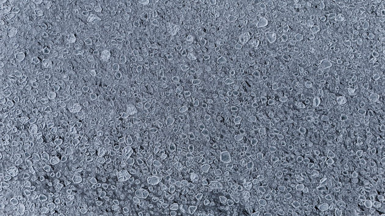 Detailed view of frozen bubbles on an icy surface capturing winter textures. — UV resistant epoxy coating